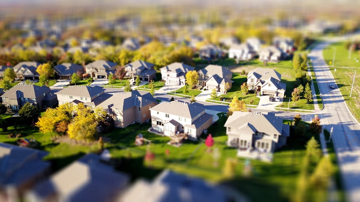 A magnifying glass over a property contract representing the verification checks every UK seller should make before selling to a cash buyer in 2026