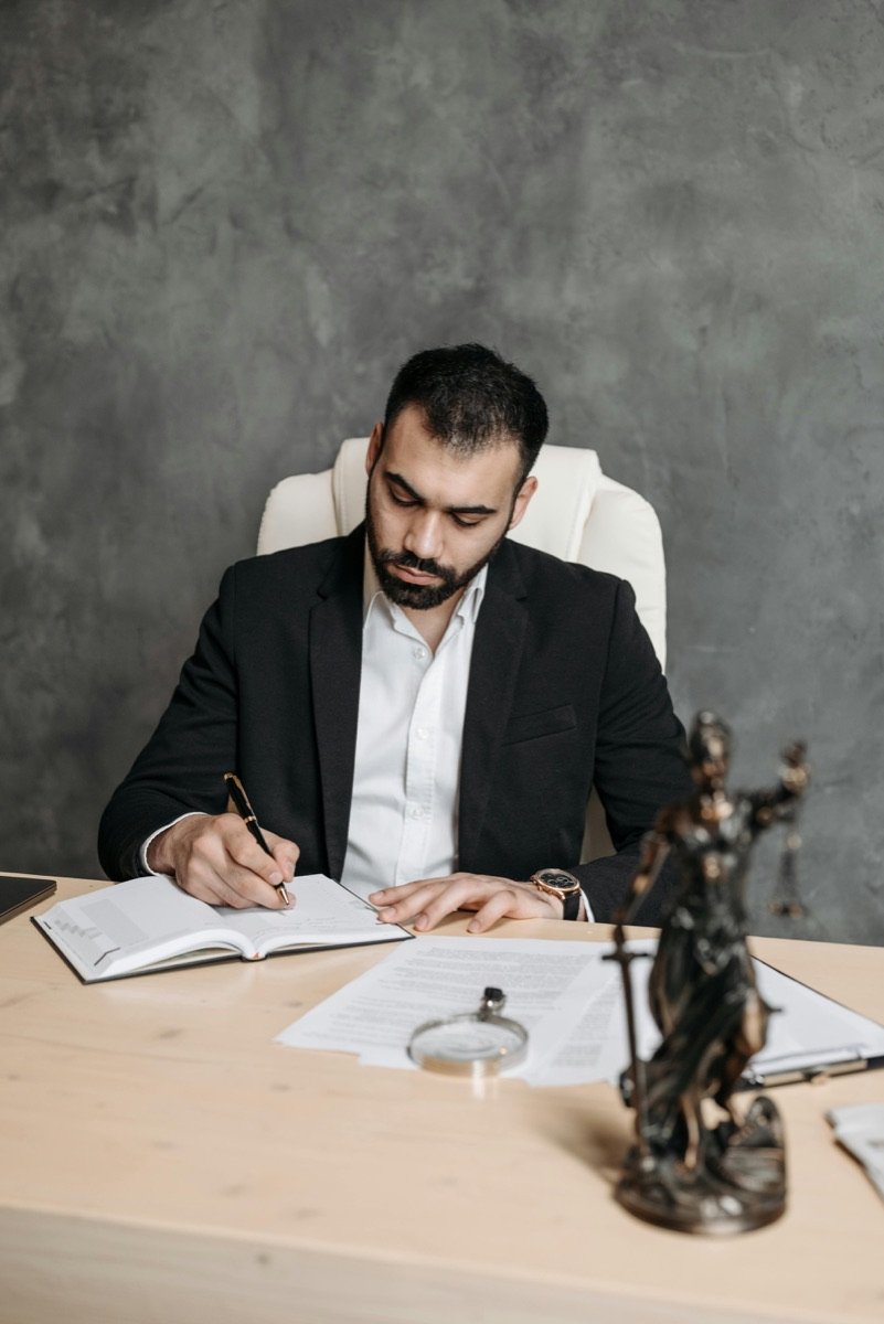 Executor reviewing probate paperwork and case law on a desk